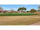 View of a lush green golf course and neighborhood homes at 19808 N Shadow Mountain Dr, Surprise, AZ 85374