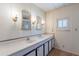 Bathroom with double vanity and updated flooring at 201 S Greenfield Rd # 142, Mesa, AZ 85206