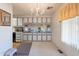 Kitchen with white cabinets, a chandelier and a mirrored backsplash at 201 S Greenfield Rd # 142, Mesa, AZ 85206