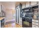 Well-equipped kitchen with a gas range and stylish backsplash at 201 S Greenfield Rd # 142, Mesa, AZ 85206