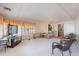 Open living room with comfortable seating and a view into another room at 201 S Greenfield Rd # 142, Mesa, AZ 85206