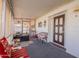 Covered porch with seating area and access to the home at 201 S Greenfield Rd # 142, Mesa, AZ 85206