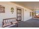 Enclosed porch with bench and decorative accents at 201 S Greenfield Rd # 142, Mesa, AZ 85206