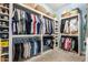 Large walk-in closet with ample shelving and hanging space at 22898 N 94Th Ln, Peoria, AZ 85383