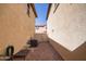 Small backyard with brick patio and AC unit at 29068 N 124Th Dr, Peoria, AZ 85383