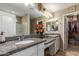 Elegant bathroom with double vanity and large walk-in closet at 29068 N 124Th Dr, Peoria, AZ 85383