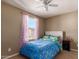 Charming bedroom with full bed, ceiling fan, and cheerful decor at 29068 N 124Th Dr, Peoria, AZ 85383