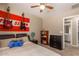Bedroom with double bed, dresser, and adjacent bathroom at 29068 N 124Th Dr, Peoria, AZ 85383
