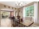 Bright dining area with tile flooring and access to a patio at 29068 N 124Th Dr, Peoria, AZ 85383