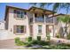 Two-story home with balcony, landscaping, and a walkway at 29068 N 124Th Dr, Peoria, AZ 85383