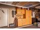 Organized garage with built-in cabinets and overhead storage at 29068 N 124Th Dr, Peoria, AZ 85383