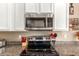 Stainless steel appliances and granite countertops in kitchen at 29068 N 124Th Dr, Peoria, AZ 85383