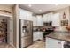 Modern kitchen with stainless steel appliances and granite countertops at 29068 N 124Th Dr, Peoria, AZ 85383