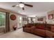 Spacious living room with comfy sectional sofa and access to balcony at 29068 N 124Th Dr, Peoria, AZ 85383