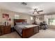 Spacious main bedroom with king-size bed, dresser, and workspace at 29068 N 124Th Dr, Peoria, AZ 85383