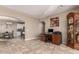 Home office with wood desk and built-in shelving at 29068 N 124Th Dr, Peoria, AZ 85383