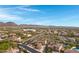 Two-story house with solar panels, pool, and mountain views in a residential neighborhood at 31271 N 133Rd Dr, Peoria, AZ 85383