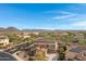 Two-story house with solar panels and mountain views in a residential neighborhood at 31271 N 133Rd Dr, Peoria, AZ 85383