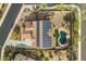 Two-story house with solar panels, pool, and backyard at 31271 N 133Rd Dr, Peoria, AZ 85383