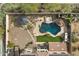 Backyard with pool, spa, and outdoor kitchen area at 31271 N 133Rd Dr, Peoria, AZ 85383