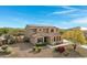 Two-story house with solar panels, pool, and landscaped yard at 31271 N 133Rd Dr, Peoria, AZ 85383