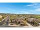 Two-story house with solar panels, pool, and mountain views in a residential neighborhood at 31271 N 133Rd Dr, Peoria, AZ 85383