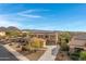 Two-story house with solar panels, pool, and mountain views in a residential neighborhood at 31271 N 133Rd Dr, Peoria, AZ 85383