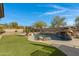 Spacious backyard oasis with a pool, gazebo, and lush lawn at 31271 N 133Rd Dr, Peoria, AZ 85383