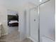 Bathroom with a walk-in shower and access to bedroom at 31271 N 133Rd Dr, Peoria, AZ 85383
