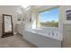 Spa-like bathroom with soaking tub and a view at 31271 N 133Rd Dr, Peoria, AZ 85383