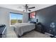 Bedroom with a large window, offering scenic views at 31271 N 133Rd Dr, Peoria, AZ 85383