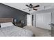 Bedroom featuring a double bed, ceiling fan, and walk-in closet at 31271 N 133Rd Dr, Peoria, AZ 85383