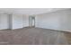 Spacious bonus room with neutral carpeting and access to bathroom at 31271 N 133Rd Dr, Peoria, AZ 85383