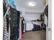 Large walk-in closet with ample shelving and hanging space at 31271 N 133Rd Dr, Peoria, AZ 85383