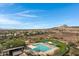 Community pool and park with walking path and desert landscape at 31271 N 133Rd Dr, Peoria, AZ 85383