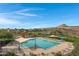 Community pool with lounge chairs, ramadas and desert mountain views at 31271 N 133Rd Dr, Peoria, AZ 85383