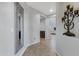 Bright and spacious entryway with decorative mirror and chandelier at 31271 N 133Rd Dr, Peoria, AZ 85383