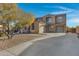Two-story home with a large driveway and landscaping at 31271 N 133Rd Dr, Peoria, AZ 85383