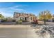 Two story house with front yard landscaping and driveway at 31271 N 133Rd Dr, Peoria, AZ 85383