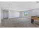 Spacious game room with foosball table and large windows at 31271 N 133Rd Dr, Peoria, AZ 85383