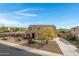 Two-story house with solar panels and landscaped yard at 31271 N 133Rd Dr, Peoria, AZ 85383