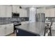 Modern kitchen with stainless steel appliances and ample cabinet space at 31271 N 133Rd Dr, Peoria, AZ 85383