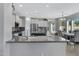 Open kitchen with large island and breakfast bar at 31271 N 133Rd Dr, Peoria, AZ 85383