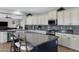 Spacious kitchen with island, stainless steel appliances, and granite countertops at 31271 N 133Rd Dr, Peoria, AZ 85383