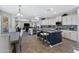 Modern kitchen with center island and granite countertops at 31271 N 133Rd Dr, Peoria, AZ 85383