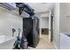 Laundry room with extra refrigerator and storage at 31271 N 133Rd Dr, Peoria, AZ 85383