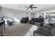 Spacious living room with comfortable seating and access to kitchen at 31271 N 133Rd Dr, Peoria, AZ 85383