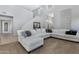 Bright living room with an L-shaped sofa and high ceilings at 31271 N 133Rd Dr, Peoria, AZ 85383