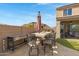 Outdoor kitchen with built-in grill and seating area at 31271 N 133Rd Dr, Peoria, AZ 85383