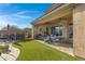 Outdoor patio with seating, fire place and built-in grill at 31271 N 133Rd Dr, Peoria, AZ 85383